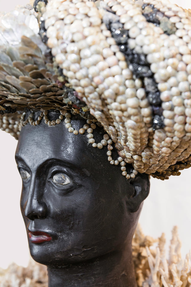 Dark-skinned woman head, early 20th Century