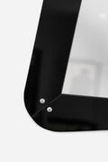 Black opaline framed mirror, circa 1960