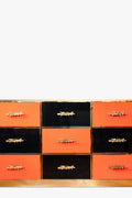 Chest of drawers in black and orange, circa 1980s