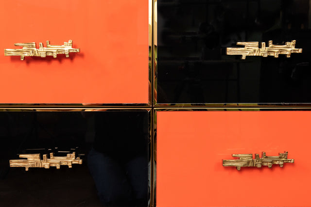 Chest of drawers in black and orange, circa 1980s