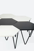 Set of seven hexagonal coffee tables, circa 1955